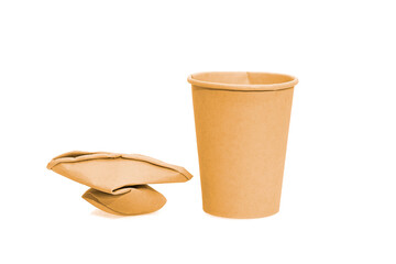 A Crumpled used brown paper cup isolation on white Background. Environment friendly concept.	