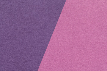 Fototapeta premium Texture of craft purple and lilac paper background, half two colors, macro. Structure of vintage violet cardboard.