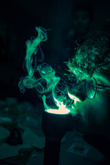 boy smokes up with green torch