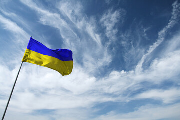 Ukrainian blue and yellow flag opposite the sky