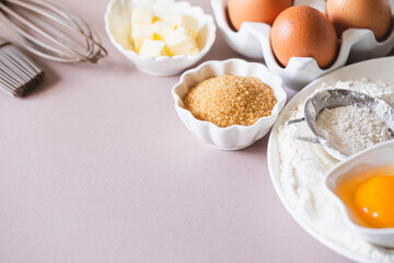 Baking or cooking background frame. Ingredients, kitchen items for baking cakes. Kitchen utensils, flour, eggs, brown sugar, butter. Text space, top view. Cookies Pie Or Cake Recipe Mockup