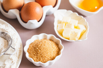 Baking or cooking background frame. Ingredients, kitchen items for baking cakes. Kitchen utensils, flour, eggs, brown sugar, butter. Text space, top view. Cookies Pie Or Cake Recipe Mockup