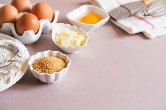 Baking or cooking background frame. Ingredients, kitchen items for baking cakes. Kitchen utensils, flour, eggs, brown sugar, butter. Text space, top view. Cookies Pie Or Cake Recipe Mockup