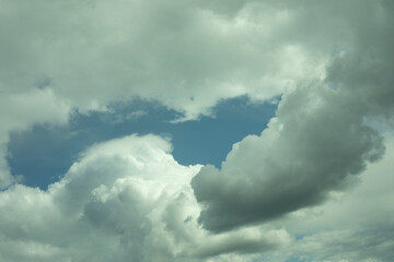 Clouds in the sky. White air masses in the blue sky.