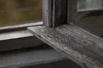 Old window frame. Window in old house. Unpainted board.