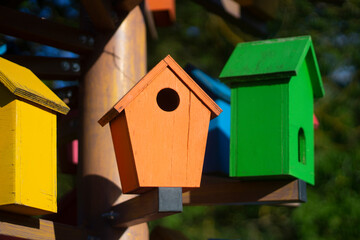 Obraz na płótnie Canvas Houses for birds. Colored wooden houses. An element in the park. Art object for animals.