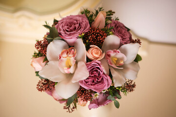 wedding rings on a bouquet of roses
