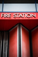 Fire station sign against bright red background