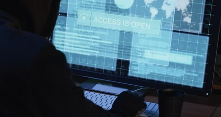 Hacker does internet crimes thieving secret information of government organization displayed on screen in office closeup. Access to sensitive data
