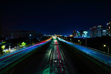 Fototapeta na wymiar A night traffic jam at the urban street in Tokyo wide shot