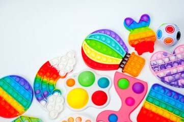 Rainbow bubble toys in different shapes to relieve stress.