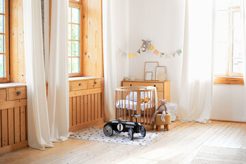Modern interior of a children's bedroom. Copy space. Hygge. Kindergarten. Cozy Scandinavian lights...