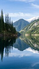 Fototapeta na wymiar Beautiful mountain lake in the forest
