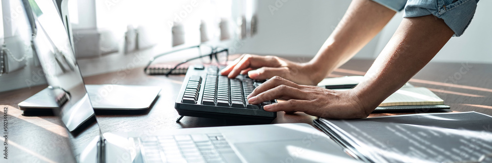 Aufkleber asian woman programmer is writing code data with keyboard on laptop for new website or applications