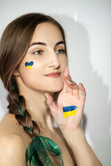 A patriotic girl with national symbols of Ukraine, no war