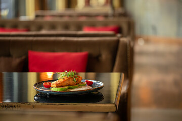 Grilled salmon steak with zucchini and creamy sauce