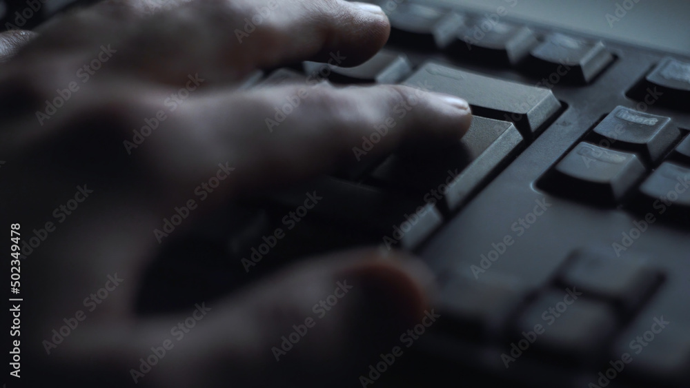 Poster close-up man presses keyboard key. man presses button enter computer keyboard. man's hand presses ke