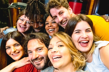 Selfie of large group of people, many people around a woman taking a big selfy of a multiracial group, celebration home party, people from different part of the world, multi age and diversity concept