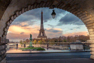 Paris, France - November 19, 2020: Eiffel tower seen from arch of Bir Hakeim bridge in Paris