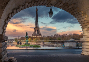 Paris, France - November 19, 2020: Eiffel tower seen from arch of Bir Hakeim bridge in Paris - Powered by Adobe