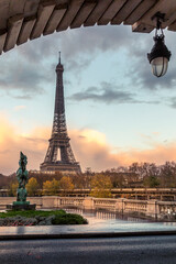 Paris, France - November 19, 2020: Eiffel tower seen from arch of Bir Hakeim bridge in Paris - obrazy, fototapety, plakaty