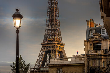 Fototapeta na wymiar Paris, France - December 11, 2021: Nice view of Eiffel tower with Haussmann building in Paris