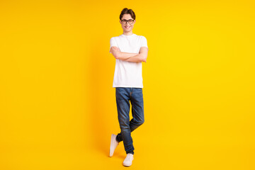 Fototapeta na wymiar Full size photo of young man confident crossed hands wear casual outfit isolated over yellow color background