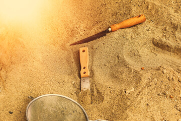 Shovel in the sand.Skeleton and archaeological tools.Digging for fossils.