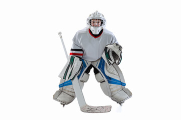Full-length portrait of boy, hockey player, goalkeeper training, playing isolated over white studio background