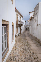 Fototapeta na wymiar Street with traditional white houses in medieval village Marvao (Portugal, Alentejo)