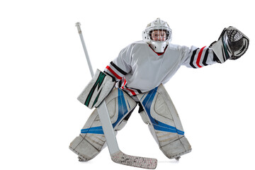 Dynamic portrait of teen boy, hockey player, goalkeeper catching puck with special glove isolated over white studio background