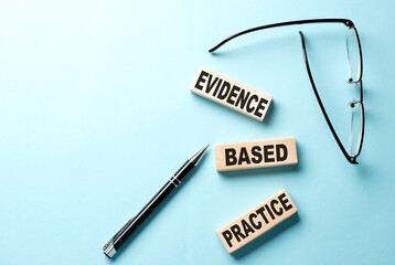 Text EBP Evidence-based practice concept on wooden block on the blue background