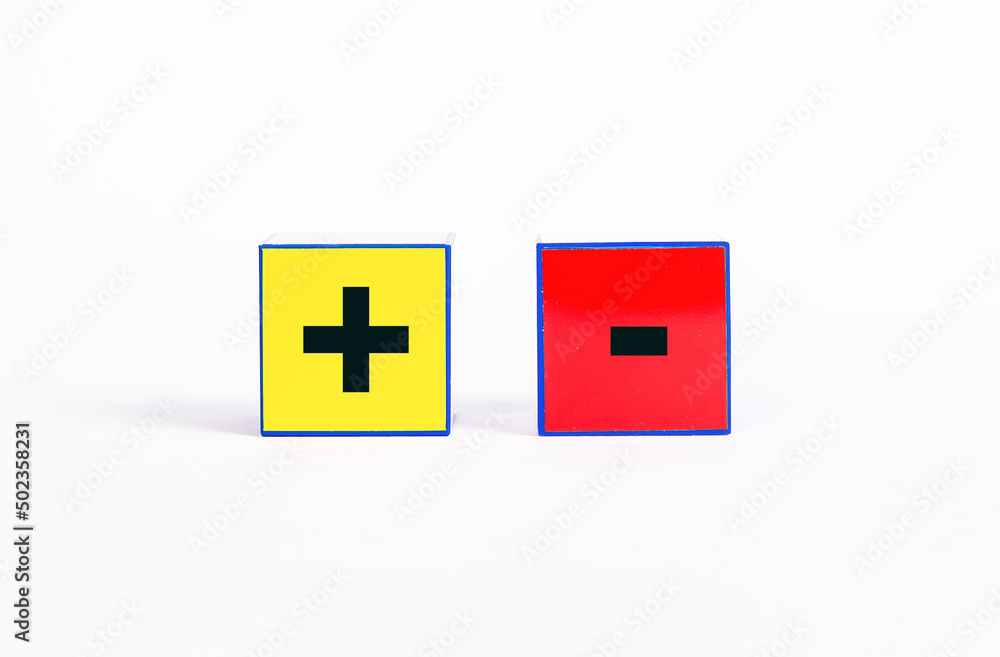 Poster cubes with plus and minus. positive and negative features or choice between opposites and difference