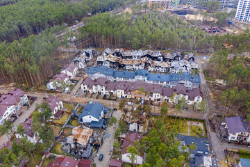 Top view of the destroyed and burnt houses. Houses were destroyed by rockets or mines from Russian soldiers. Cities of Ukraine after the Russian occupation.