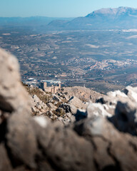View of the castle, the cross and part of the city of Jaén from a high mountain.