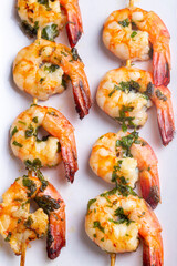 Skewered grilled shrimp with sauce