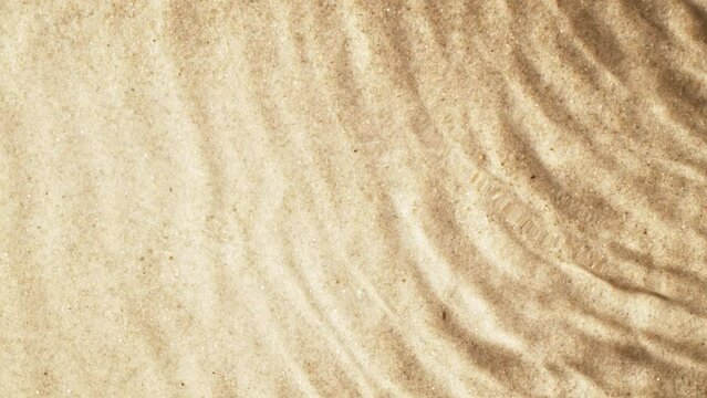 Super slow motion of water waves with sand texture. Filmed on high speed cinema camera, 1000 fps.