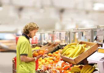 Man buying fruits at the market