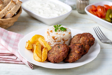 Traditional Turkish food; dry meatballs or inegöl meatballs with potatoes (Turkish name; Kuru kofte)