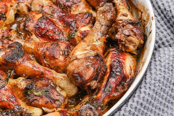 Obraz na płótnie Canvas Hot homemade chicken with balsamic vinegar sauce in a baking dish. Shallow depth of field