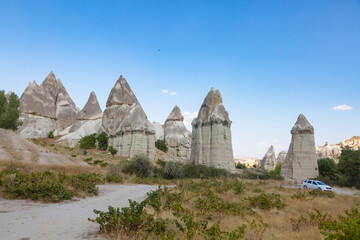 Cappadocia’s landscape includes dramatic expanses of soft volcanic rock, shaped by erosion into towers, cones, valleys, and caves.