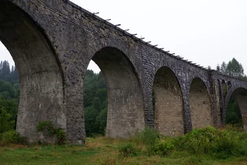 Velvet curtains Landwasser Viaduct The famous old viaduct in the Ukrainian mountains. Carpathians, Vorokhta
