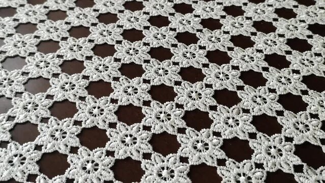 knitted lace tablecloth with rope, handicrafts. tablecloth in a restaurant you need to bear the table
