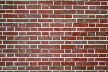 Brick wall of red color, background of old vintage brick wall