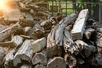 a pile of very old wooden poles