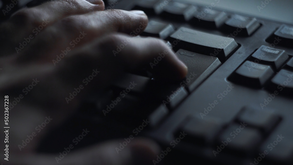 Poster close-up man presses keyboard key. man presses button enter computer keyboard. man's hand presses ke