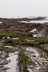 rocky cove on the coast of the basque country in the town of sopelana a cloudy day
