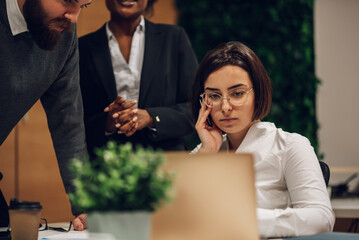 Multicultural team working together in office and having a meeting