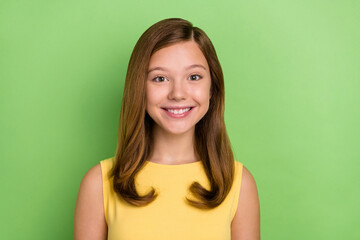 Photo of young cheerful lovely girl good mood toothy smile smart isolated over green color...