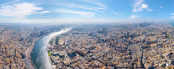 Panoramic aerial view of Dubai Creek and city skyline, Dubai, United Arab Emirates.